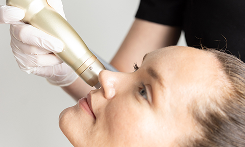 Woman receiving injector treatment