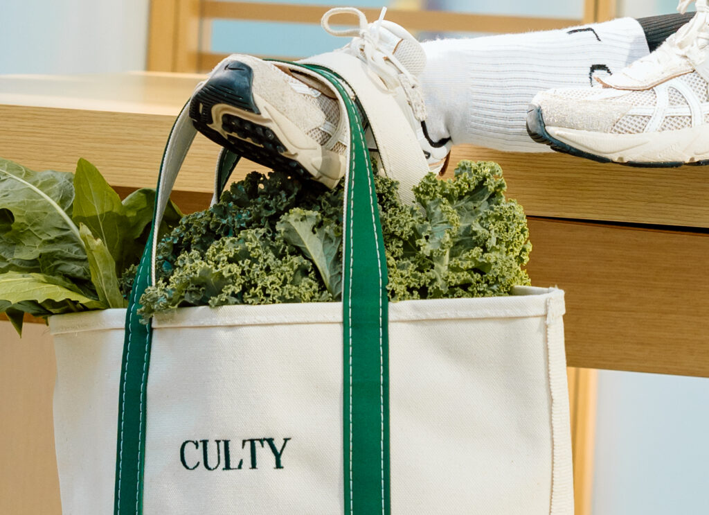 Shoes holding a "CULTY" bag