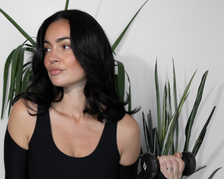 Woman holding workout equipment