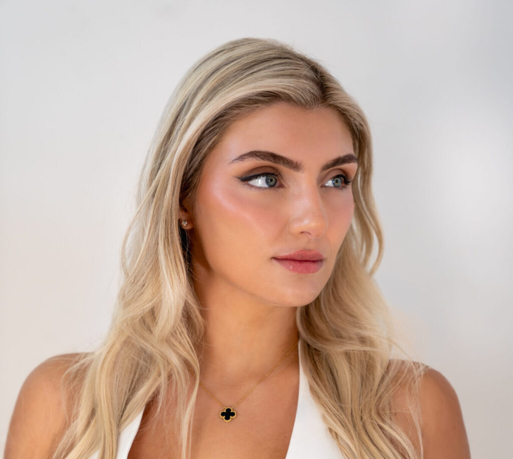 Woman with blonde hair and a white tshirt