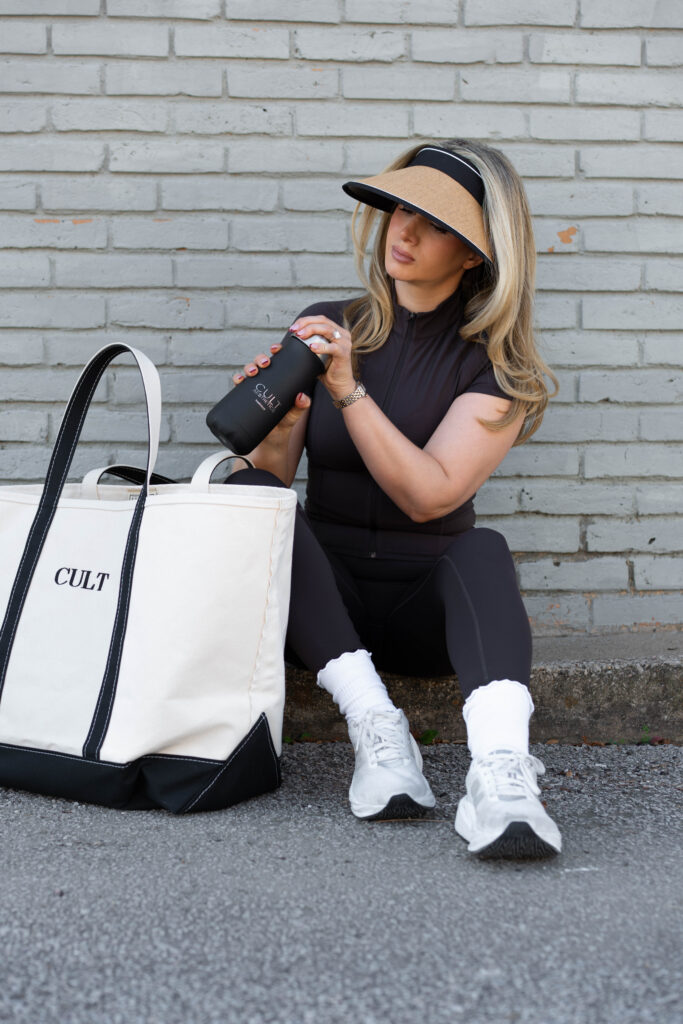 woman putting a water bottle in her bag