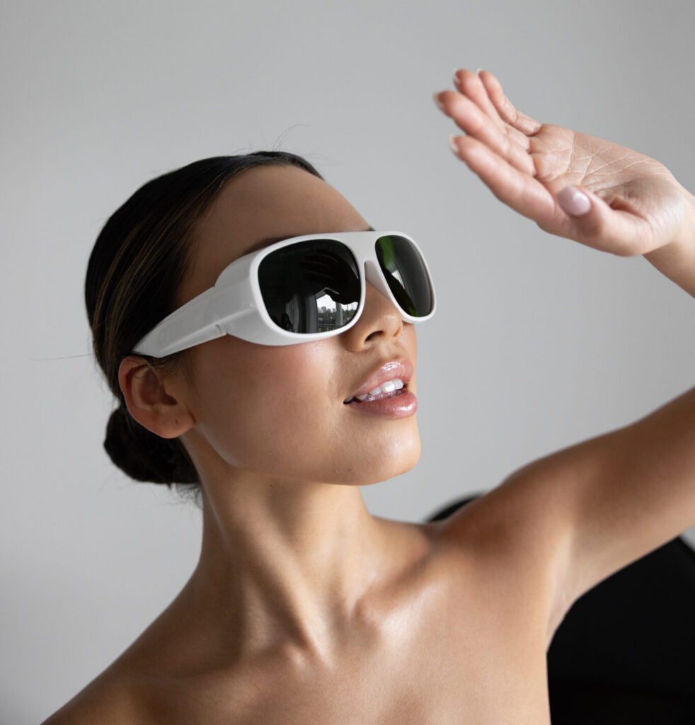 women shielding herself from the sun